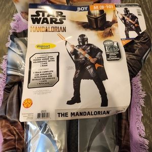 The Mandalorian Halloween costume. Boy size M (8-10). It's black and silver.